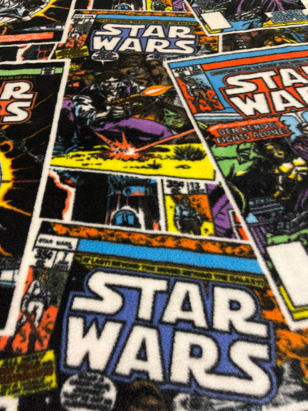 Star Wars #2.   Comic book style in black with primary colors.   60” wide, 100% polyester and $6.99 per yd.