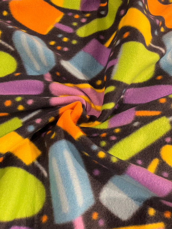 Popsicle fleece-dark navy background with bright popsicles.  58” wide, 100 polyester and $6.99 per yd.