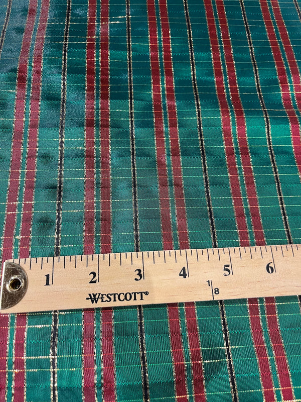 Christmas taffeta-Christmas green and red plaid with gold threads.   60”wide, 100% polyester and $9.99 per yd