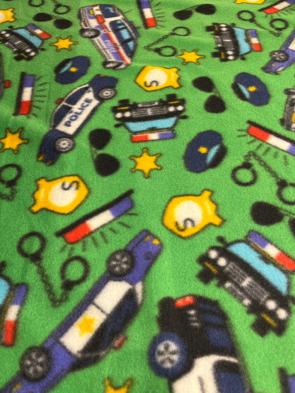 Police themed fleece in green.  60” wide, 100% polyester and $6.99 per yd