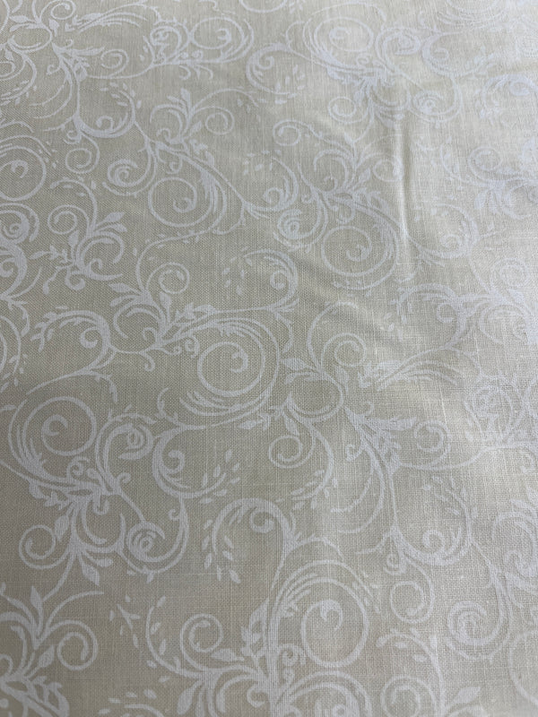 Ivory on ivory scrolls (j)quilt back.  108” wide, 100% cotton and $9.99 per yd.