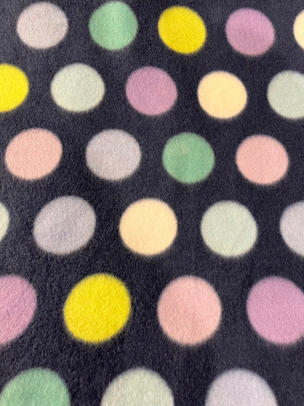 Pastel polka dots on navy background.  58” wide, 100% polyester fleece, and $6.99 per yd.