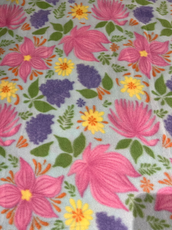 Floral fleece-light blue background with floral.  58”wide, 100% polyester and $6.99 per yd.