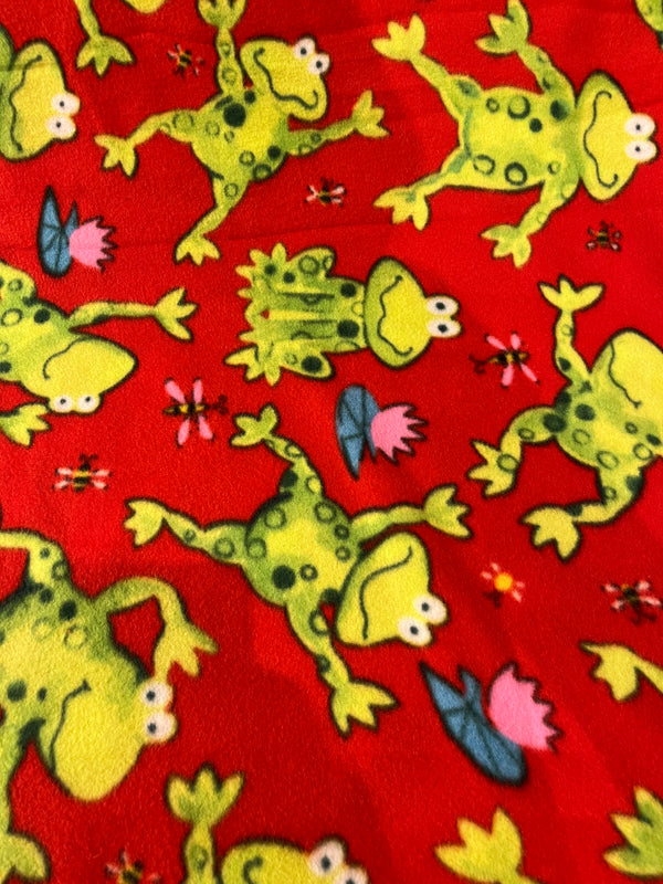 Frogs!  Green frogs on red background.  100 % polyester fleece, 58” wide and $6.99 per yd.