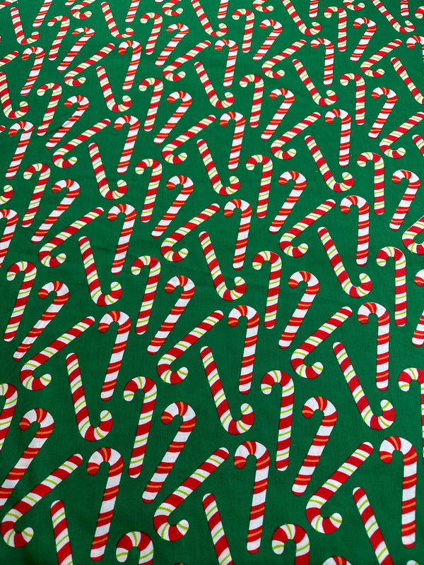 Christmas Fabric - Candy Canes on Green Poly/Cotton - 60" Wide - 65% Polyester - 35% Cotton