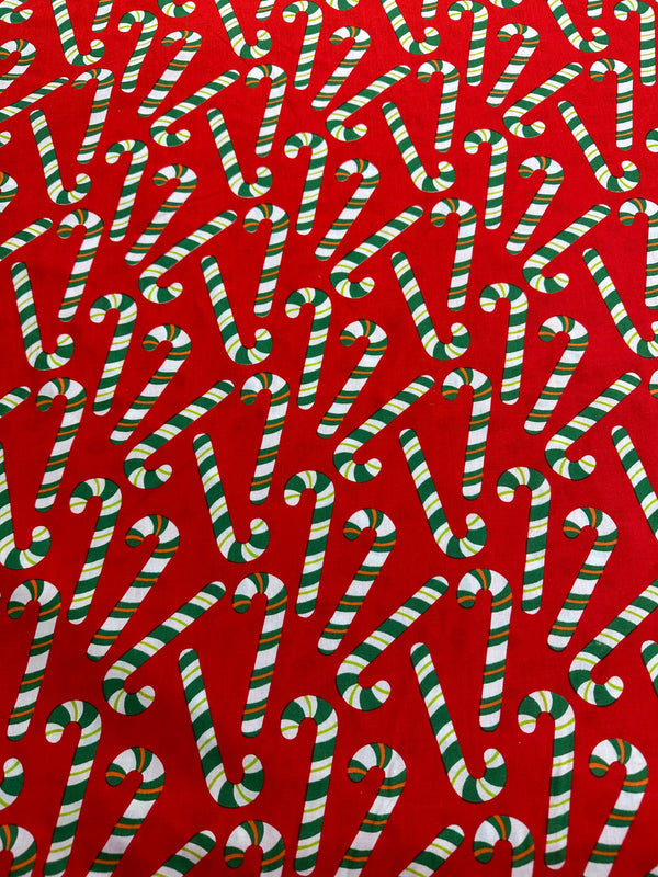 Christmas Fabric - Candy Canes on Red Poly/Cotton - 60" Wide - 65% Polyester - 35% Cotton