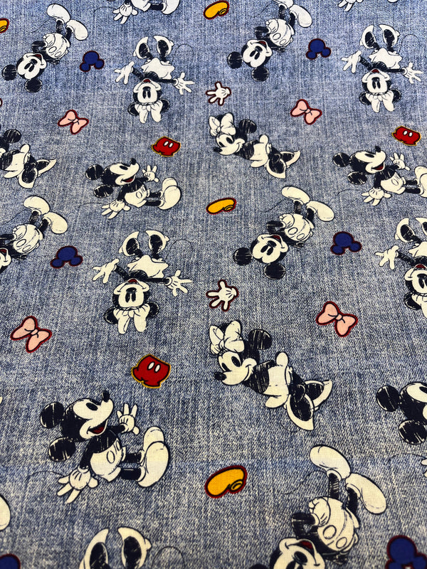 Mickey & Minnie dancing.  44” wide, 100% cotton and $4.99 per yd