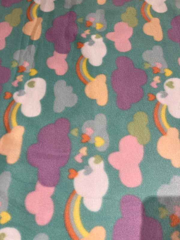 Happy days fleece-pastel clouds, rainbows and hearts on Seagreen background.  58” wide, 100% polyester and $6.99 per yd.