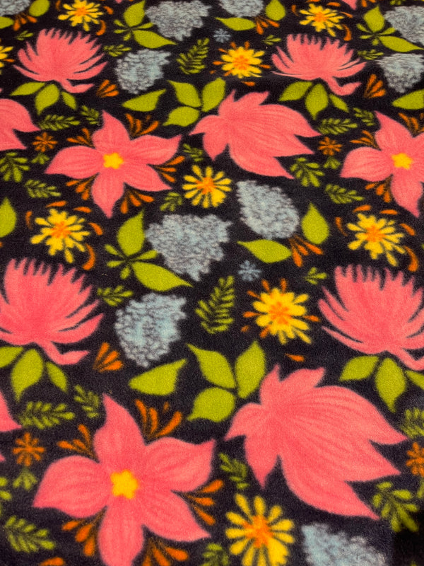Floral fleece-navy background with floral.  58” wide, 100% polyester and $6.99 per yd.