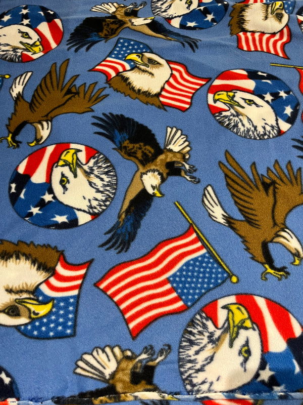 Bald eagle patriotic fleece.  Bald eagles on cornflower blue background.   58” wide, 100% polyester and $6.99 per yd.