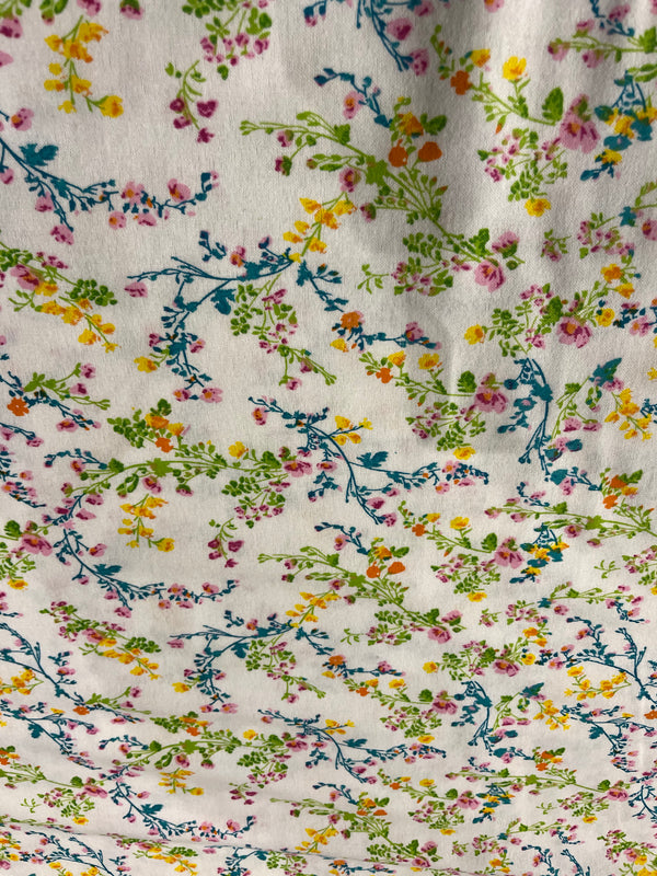 Floral flannel-yelllow, orange and pink floral on green and teal blue stems.   100% cotton, 44” wide and $4.99 per yd.