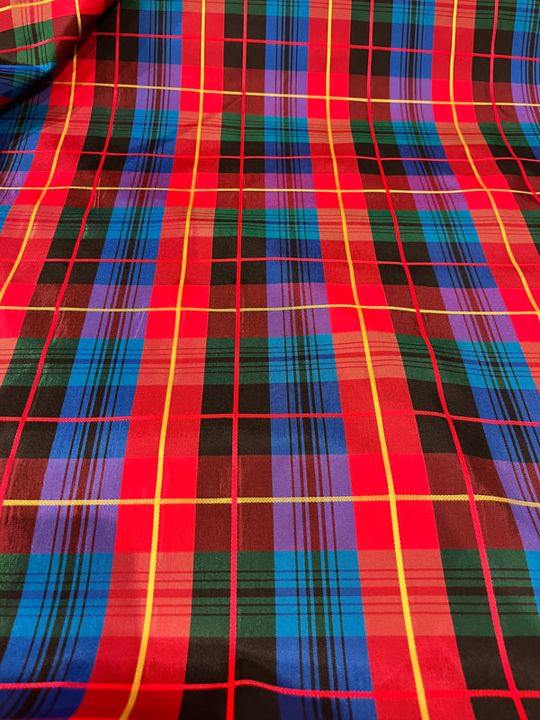 Christmas plaid taffeta.   Royal, black, red, green and yellow plaid.   50”wide, 100% polyester and $9.99 per yd.