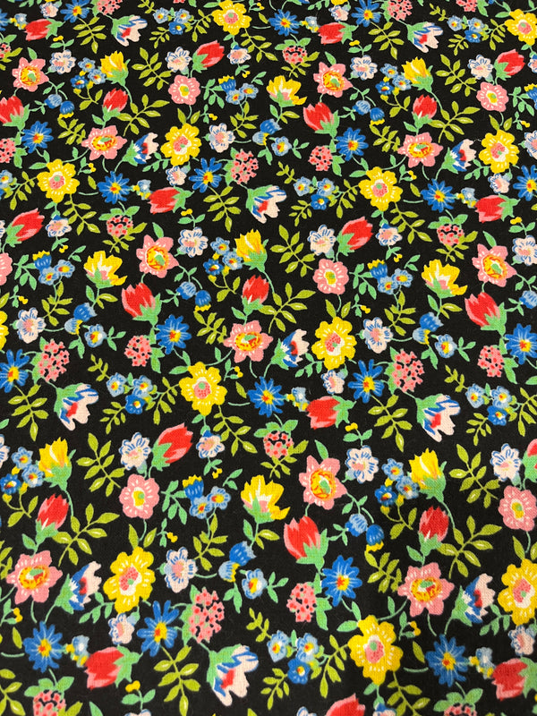 Floral flannel-black background with bright colored flowers.  100% cotton, 44” wide and $4.99 per yd.