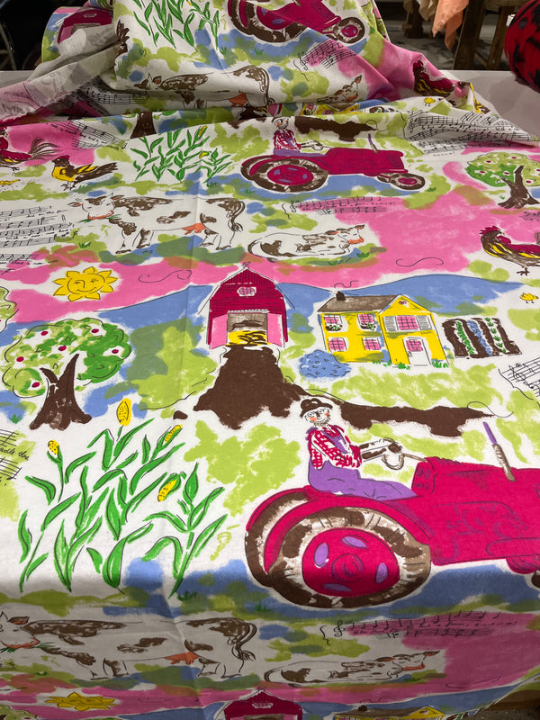 Old Macdonald flannel.  Farm scene with pinks.  100% cotton, 44” wide, 25” repeat and $4.99 per yd.
