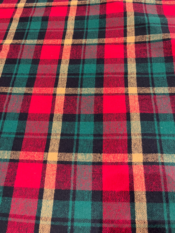 Red, green and yellow plaid flannel.  Yarn dyed, 60” wide, 100% cotton and $6.99 per yd.