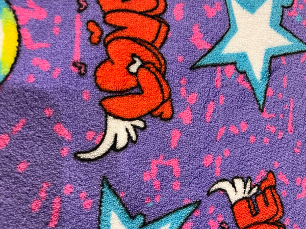 Dance,love and rock whisper fleece.   Purple background with vibrant colors. 100% polyester, 60” wide and $9.99 per yd.