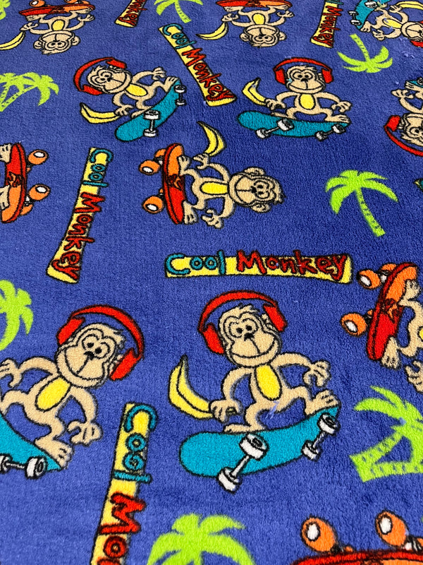 Cool monkey whisper fleece.  Monkeys on periwinkle purple background.  100% polyester, 60” wide and $9.99 per yd.