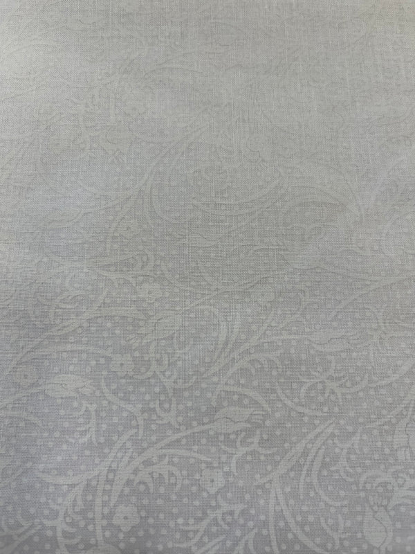 White on white tulips(a).  108” wide, 100% cotton and $9.99 per yd