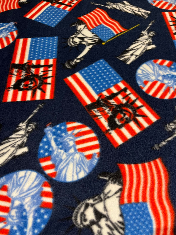 Lady liberty on navy fleece.    60” wide, 100% polyester and $6.99 per yd.